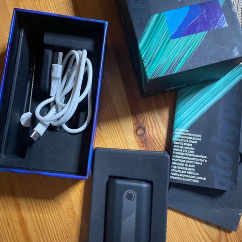 Glo Hyper Starter Kit used with cleaning brush and USB-C cable