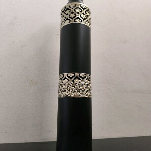 Metal vase in black color with bronze designs like new