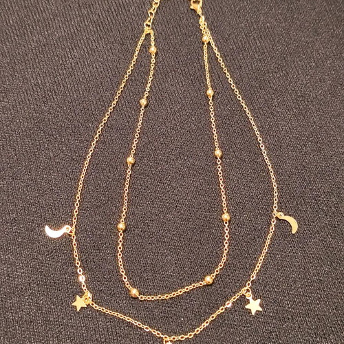Double necklace in gold color like new with stars and crescent moons