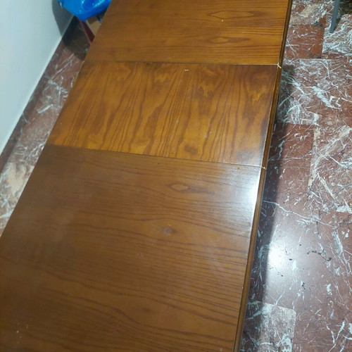 Wooden dining table with extension used
