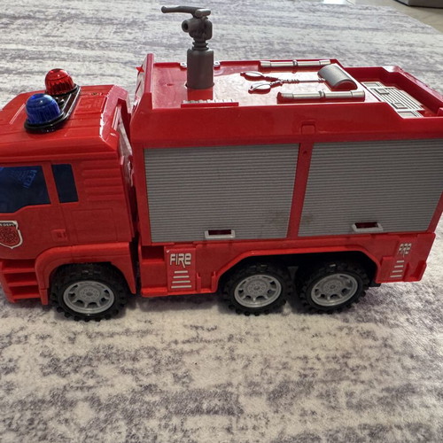 Fire truck toy used with sound, light, and water pump