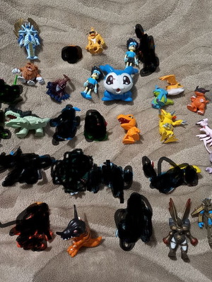 Digimon figures and collectible cards like new