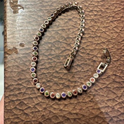 Tennis bracelet with multicolored round rhinestones and secure clasp