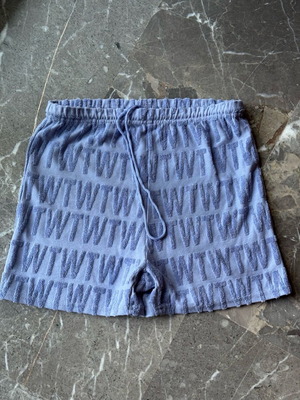 Blue shorts with letter textures like new