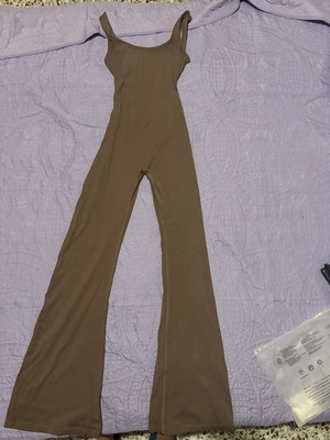 Gym Jumpsuit new with bell-bottom opening and open back, size S