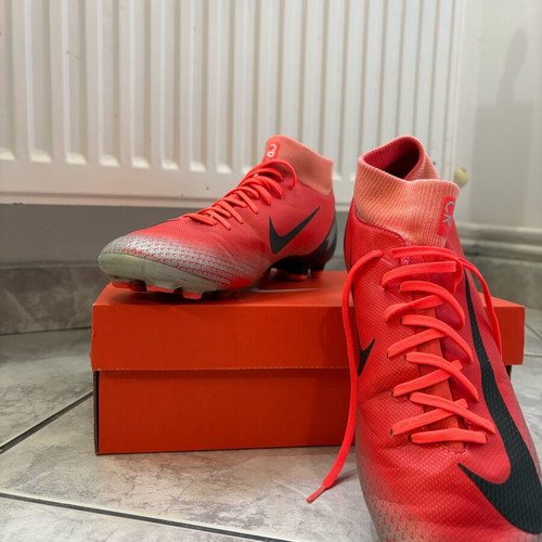 Nike football shoes like new, red and orange