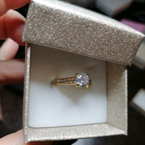 Steel solitaire ring new, gold color