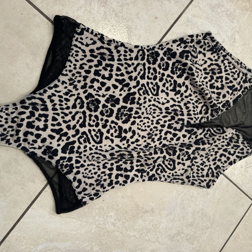 Animal print one-piece swimsuit with black mesh details