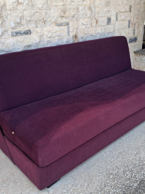 Two-seater sofa with storage compartment