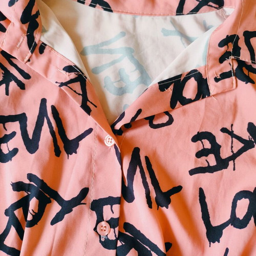 Shirt dress or tunic new, peach color with black graffiti