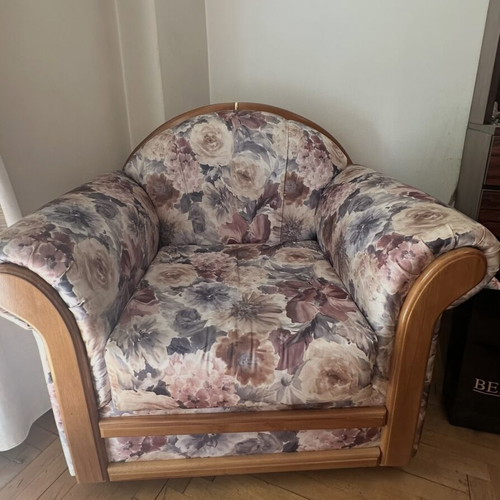 Living room sofa set with curved wooden frame and floral upholstery