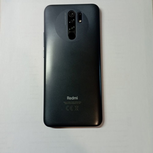 Redmi 9 64GB used smartphone with 2 cases and 2 screen protectors