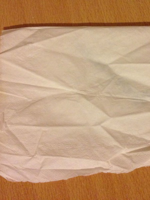 Olympic napkin with small tear