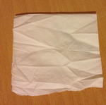 Olympic napkin with small tear