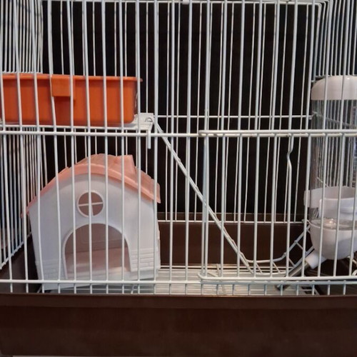 Hamster cage like new with two doors, house, feeder, and water bottle