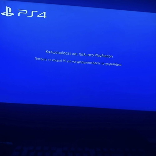 PS4 Fat console with power cable and DualShock 4 controller