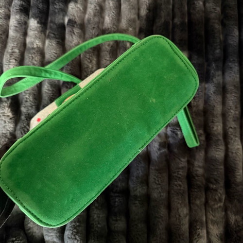 Green suede crossbody bag used with gold details
