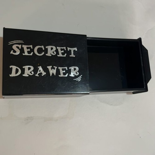 Secret drawer used, magician's box that makes objects disappear