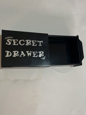 Secret drawer used, magician's box that makes objects disappear