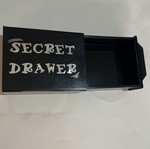 Secret drawer used, magician's box that makes objects disappear