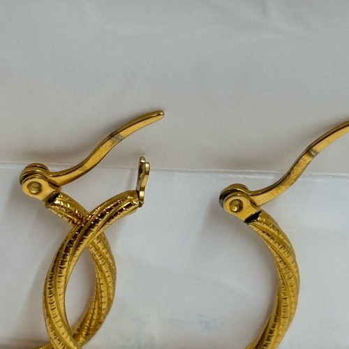 Iron golden rings with a twisted design.