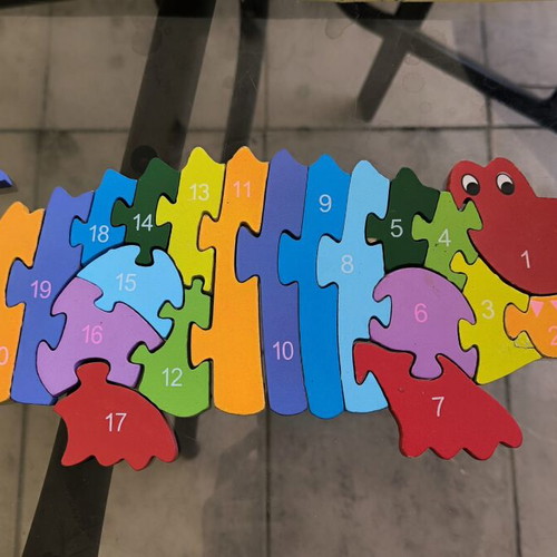 Wooden puzzle construction with letters and numbers