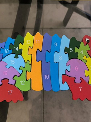 Wooden puzzle construction with letters and numbers