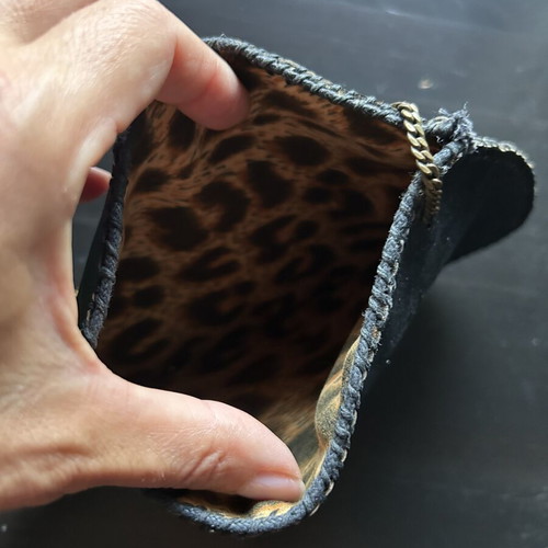 Small handbag like new, black leather with bronze chain handle, leopard interior