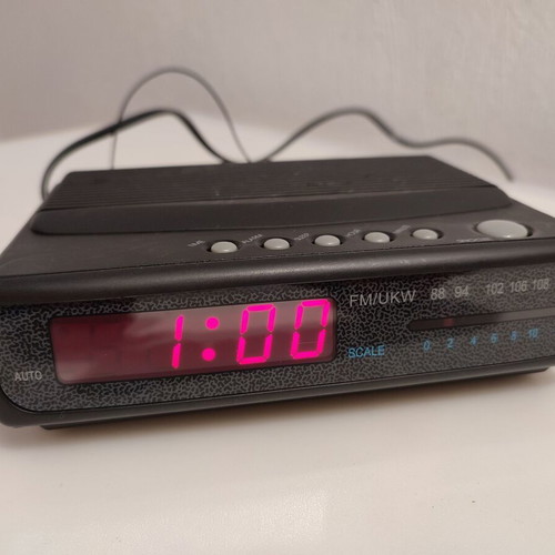 Radio alarm clock used, fully functional with some scratches