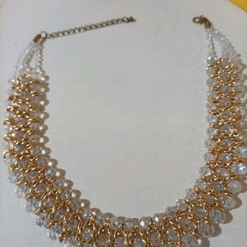 Women's evening necklace like new with gold weave and white stones