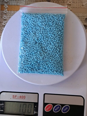 Glass beads 100g like new, blue color