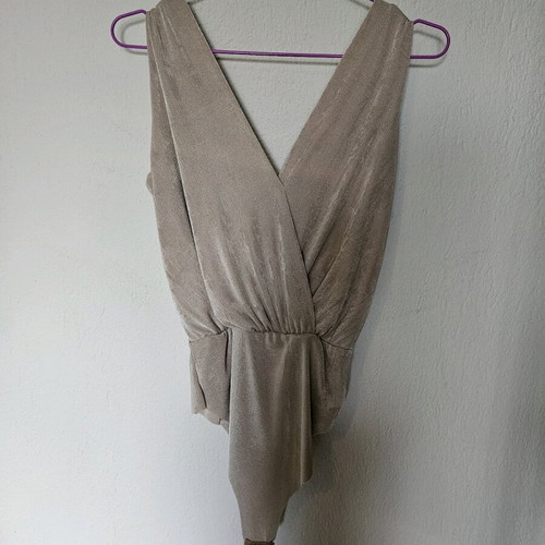 Beige-gold bodysuit like new with draped neckline and laser cut detail
