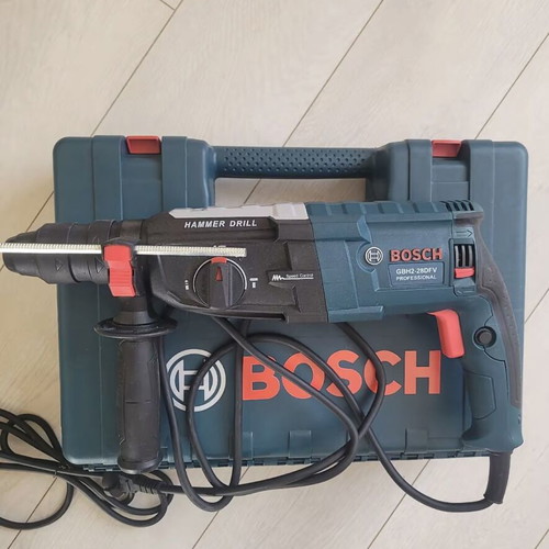 Bosch cordless rotary hammer drill with case and accessories