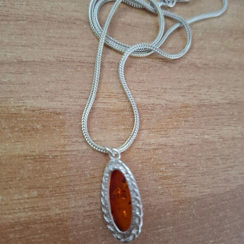 Women's oval pendant with amber and silver chain like new