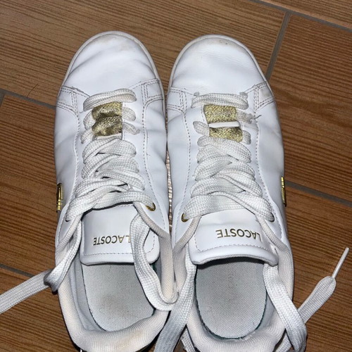 Lacoste sneakers used leather with gold details