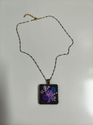 Necklace with embroidery, like new, purple flowers and gold steel chain