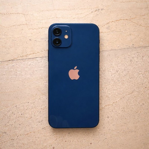 I phone 12 64GB blue like new with charger and 7 cases