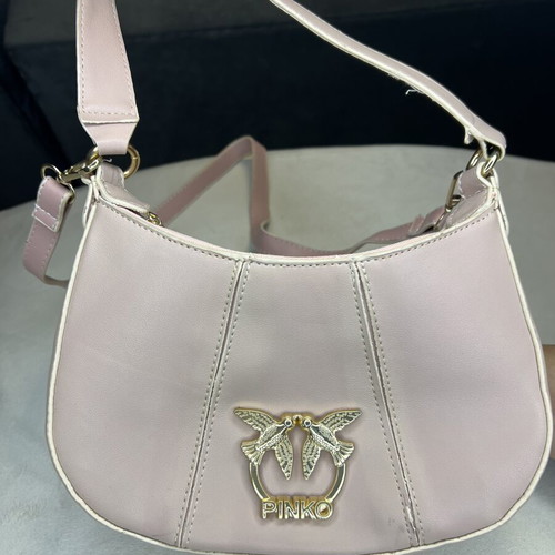 Pink shoulder bag with adjustable strap