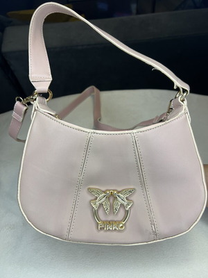 Pink shoulder bag with adjustable strap
