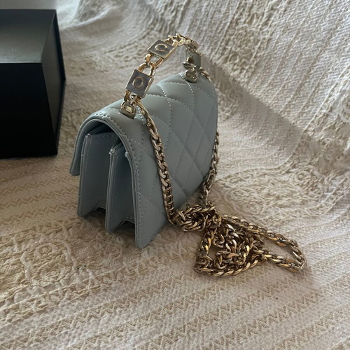 Leather baby blue handbag like new with gold chain and full packaging