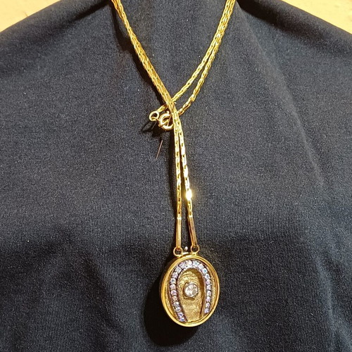 Pendant like new gold-tone horseshoe with zircon crystal