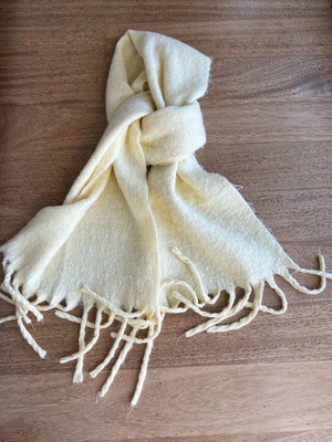 Women's yellow scarf used with fringes