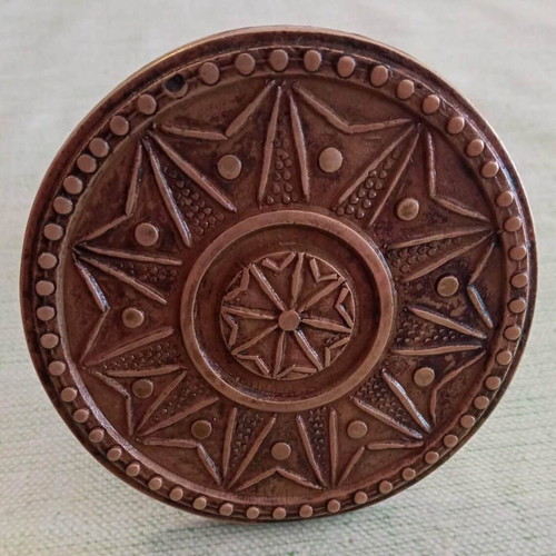 Bronze door knob used with geometric star pattern