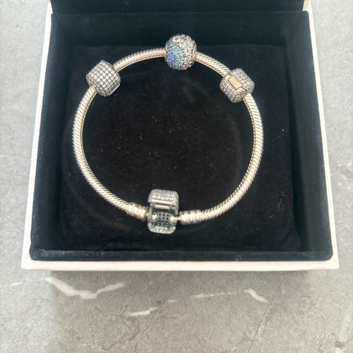 Pandora silver bracelet new with 4 charms and zirconia