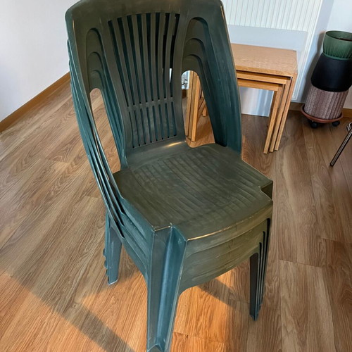 Set of 4 green plastic garden chairs