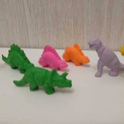 Vintage rubber dinosaur figures set used, 1980s monochrome erasers