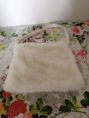 Evening bag made of synthetic fur like new, white