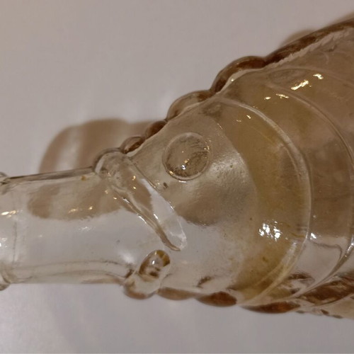 Glass bottle in fish shape used