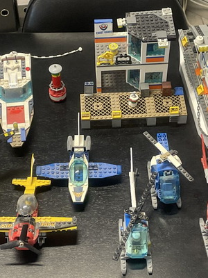 Lego lot like new with coast guard, diving yacht, race plane, police helicopters
