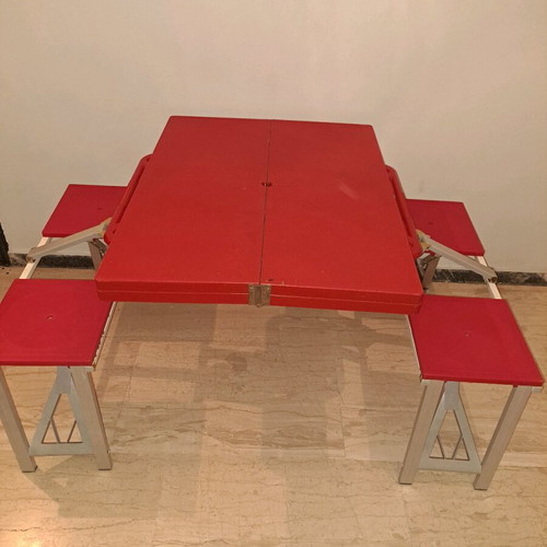 Folding camping table with 4 stools used